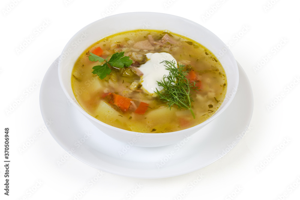 Serving of rassolnik - pearl barley meat soup with pickled cucumbers