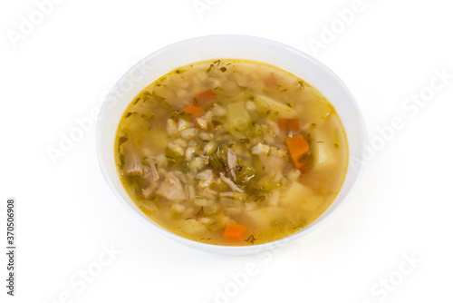 Rassolnik - pearl barley meat soup with pickled cucumbers in bowl