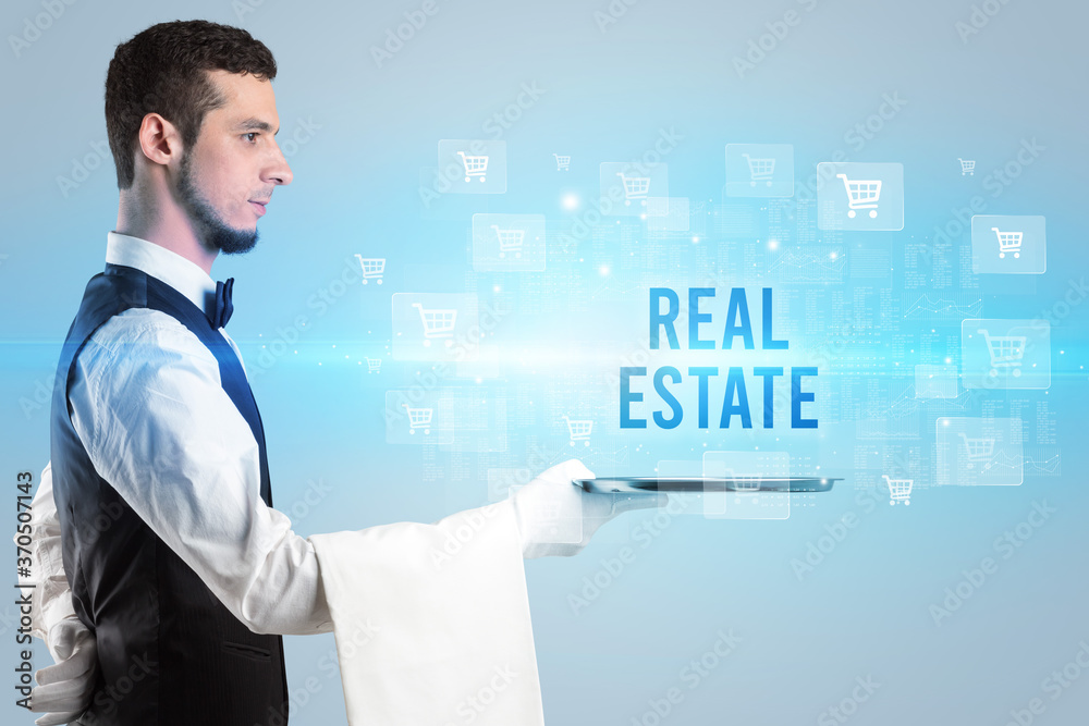 Waiter serving REAL ESTATE inscription, online shopping concept Waiter serving REAL ESTATE inscription, online shopping concept
