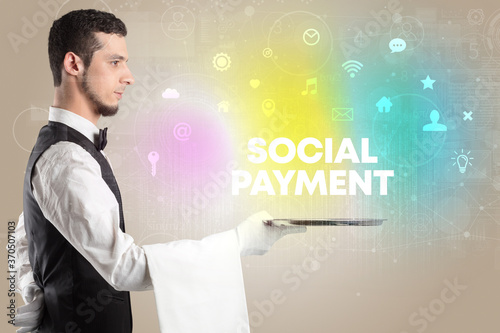 Waiter serving social networking with SOCIAL PAYMENT inscription, new media concept