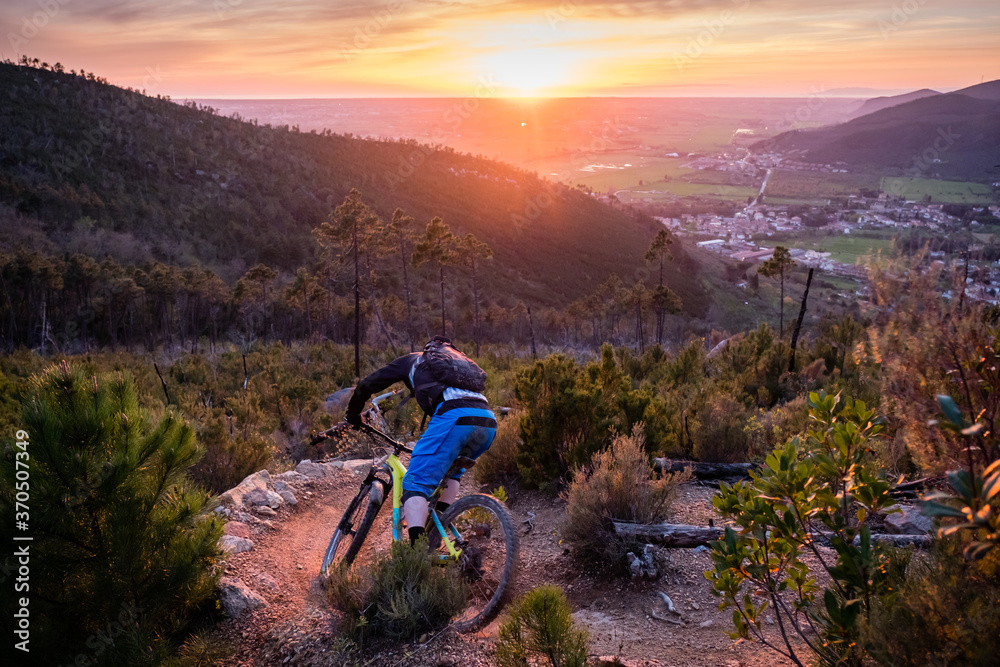 Mountain biker at sunset in Tuscany