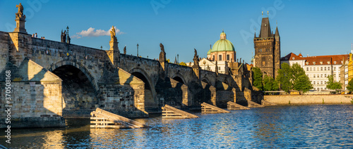 Famous Charles Bridge In Prague on a beautiful summer afternoon