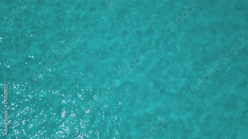 aerial view of sardinia shoreline ( mari pintau ) torquise sea water with clear blue sky in a sunny day during summer season photo