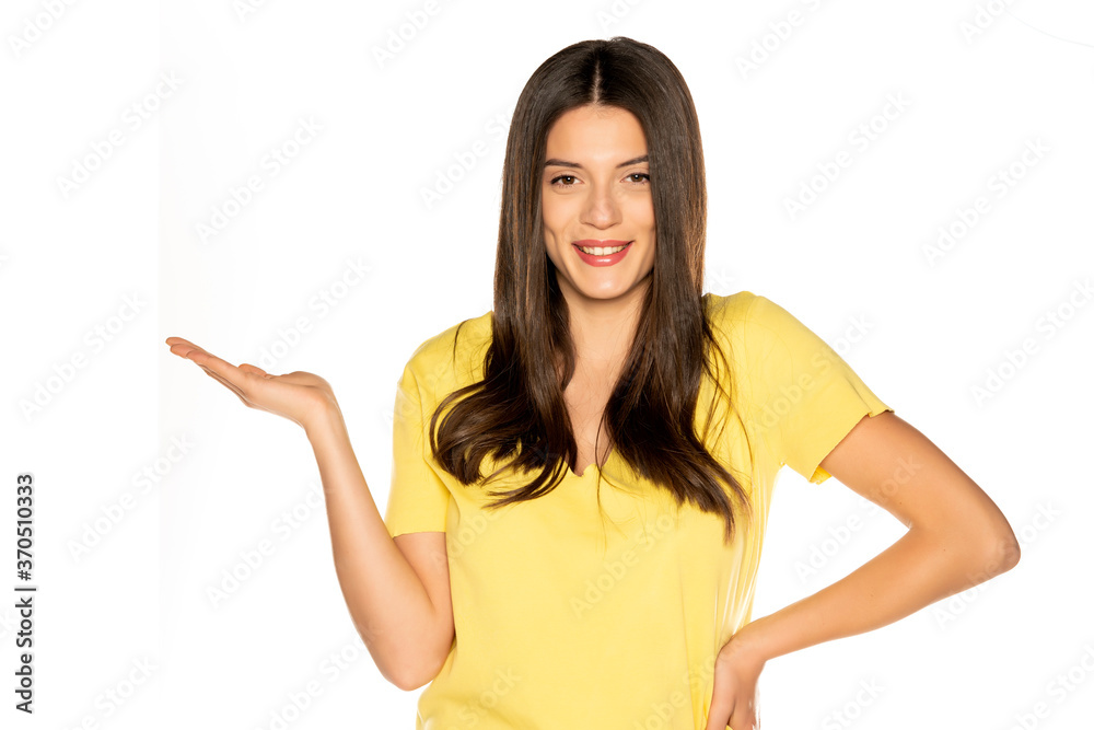 young beautiful woman holding imaginary object on her hand young beautiful woman holding imaginary object on her hand
