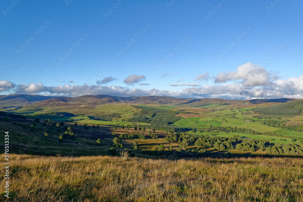 The small shallow Valley of Glen Prosen seen from the Moorland Summit of Tulloch Hill on a sunny evening in September. The small shallow Valley of Glen Prosen seen from the Moorland Summit of Tulloch Hill on a sunny evening in September.