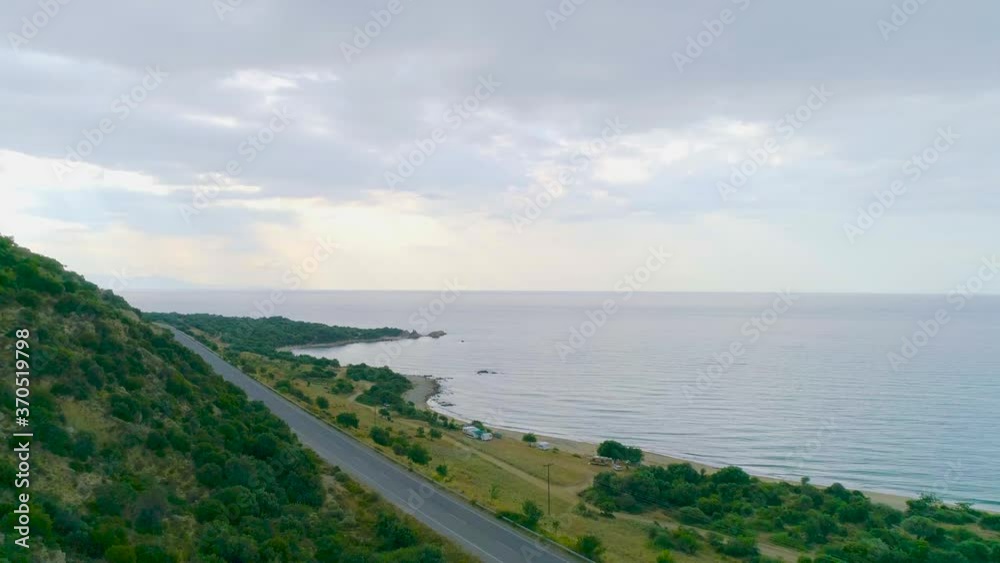 Interesting drone shot of seascape by green mountains and trees area on the hills Interesting drone shot of seascape by green mountains and trees area on the hills