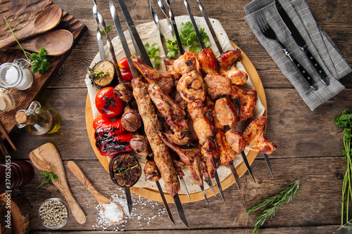 Assorted caucasian shashlyq skewers and kebabs photo