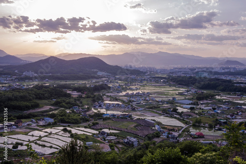 Beautiful landscape panoramic view of county side background curious clouds.