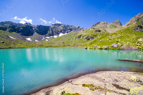 Alpine mountain lake landscape and view, blue beautiful and amazing lake panorama © taidundua