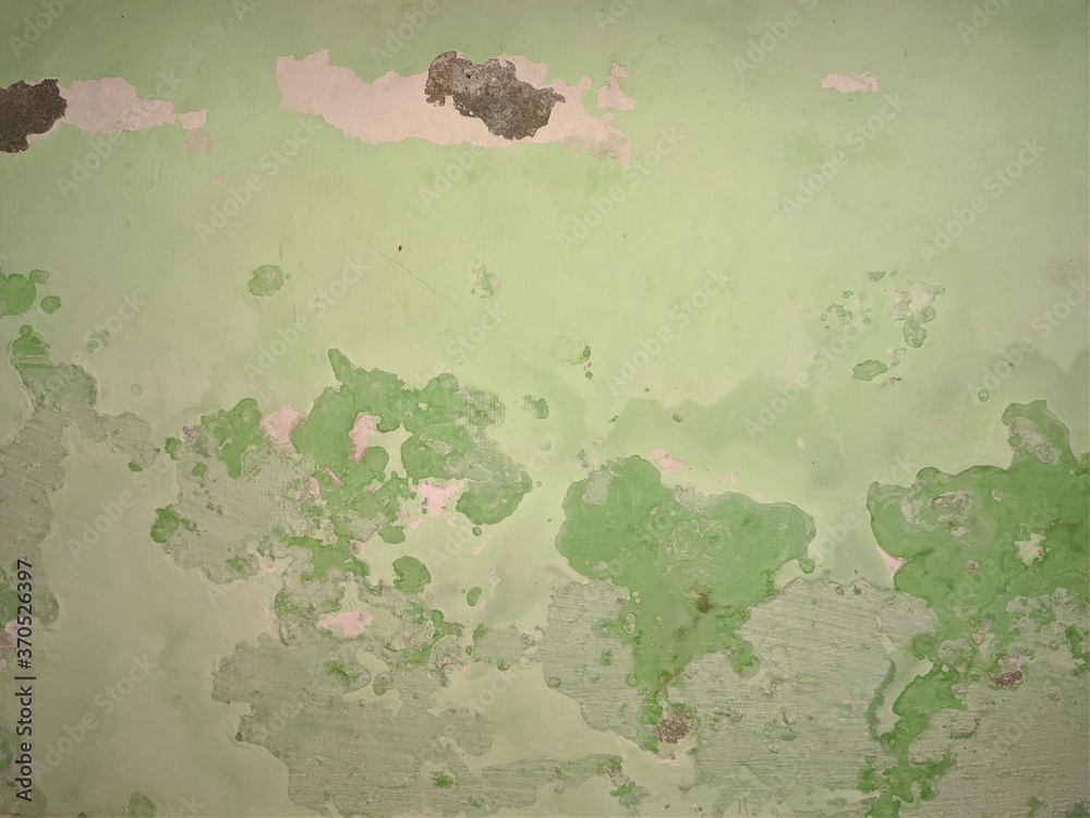 Peeling wall paint, moist damp texture on house wall with some water