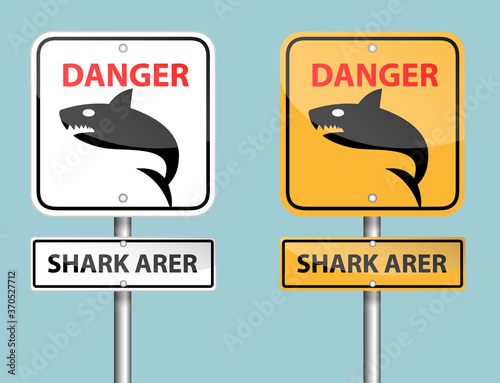 white and orange danger shark area sign pole on blue background