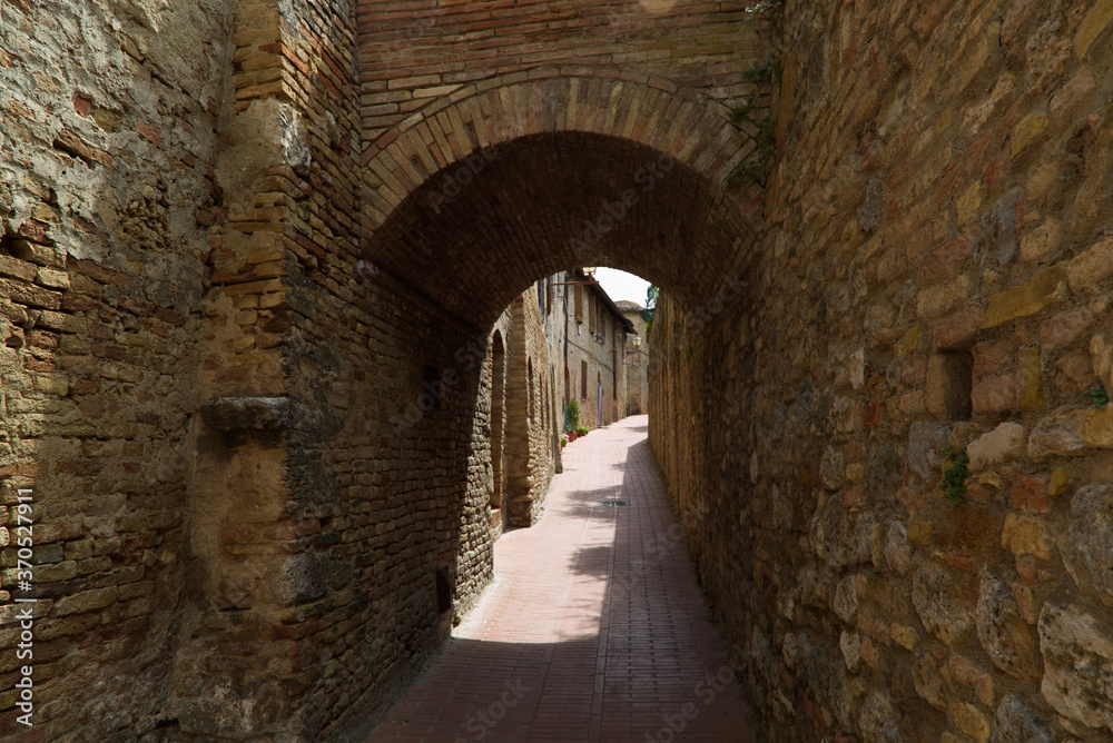 The alleys of San Gimignano medieval city in Tuscany