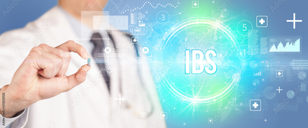 Close-up of a doctor giving you a pill with IBS abbreviation, virology concept Close-up of a doctor giving you a pill with IBS abbreviation, virology concept