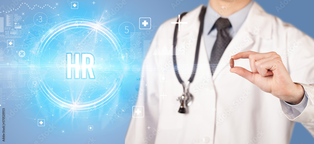 Close-up of a doctor giving you a pill with HR abbreviation, virology concept Close-up of a doctor giving you a pill with HR abbreviation, virology concept