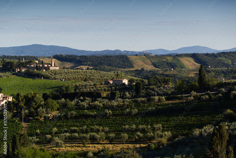 Evening lights on the Tuscan landscape, view from the town of San Gimignano