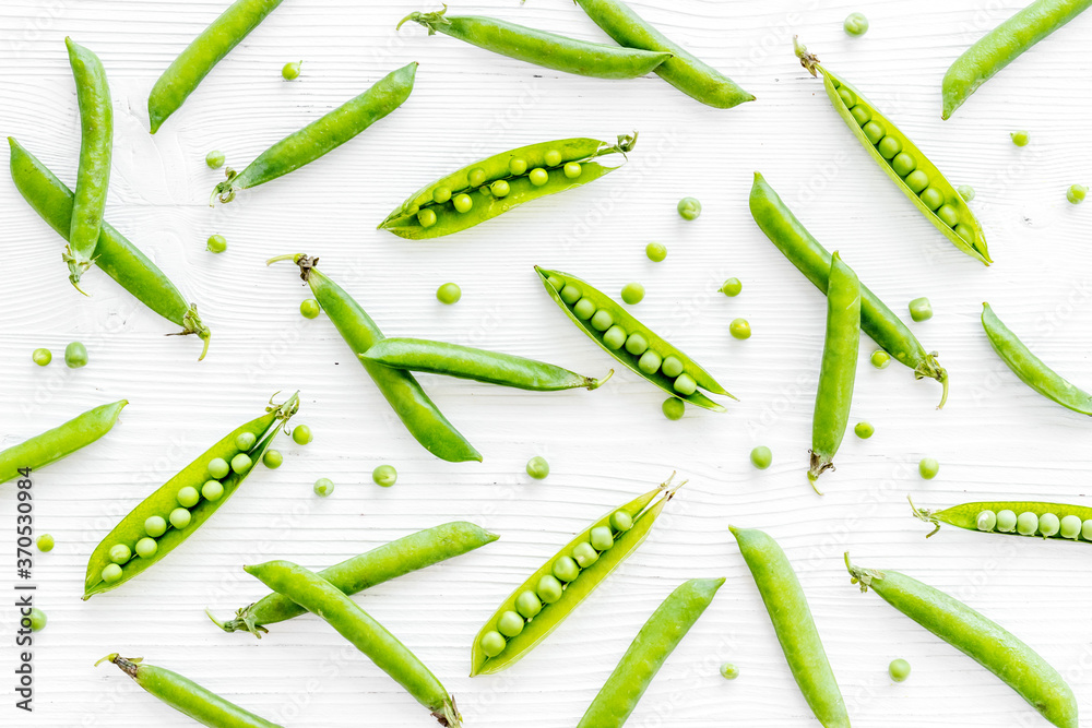 Set of green pea pods on bright background Set of green pea pods on bright background