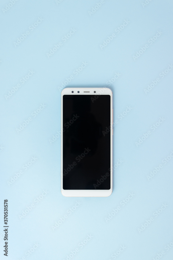 The phone on a blue background. Mock-up. Copy space. The phone on a blue background. Mock-up. Copy space.
