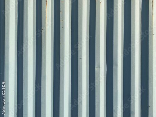 white bright shadow old corrugated shipping container wall