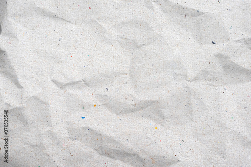 Recycled white creased paper background or cardboard surface from a paper box for packing.for the designs decoration concept.
