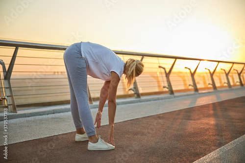 Flexible female performing a leg stretching exercise © Viacheslav Yakobchuk