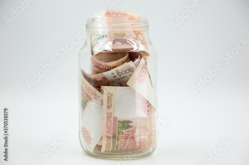 Russian rouble. the money is in a glass jar. five thousand rubles.
