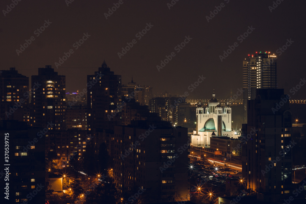 Obraz premium The night city lights. View from above on buildings. Urban atmosphere. City inspiration.
