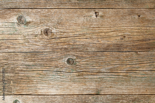 Old cracked wooden boards with splinters and knots. 