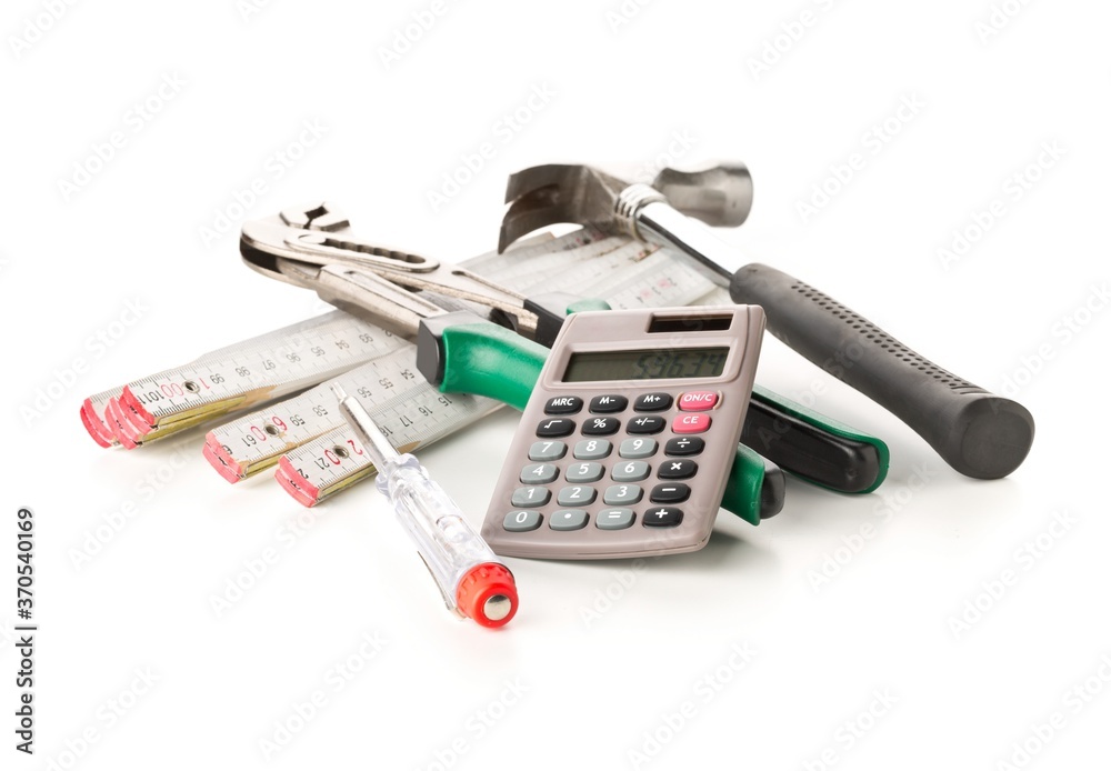 Hammer, gaspipe pliers, screwdriver and calculator on white, home renovation, craftsman cost or building expense concept