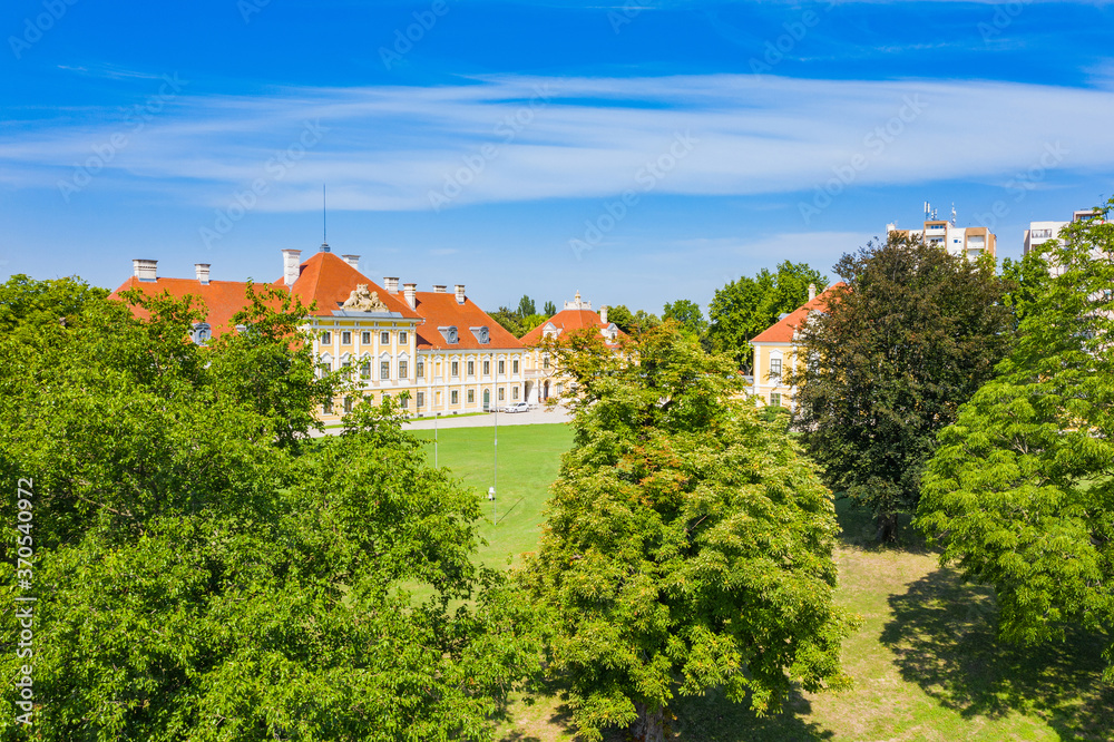 Croatia, old town of Vukovar, city museum in old castle among the trees in park, classic historic architecture

