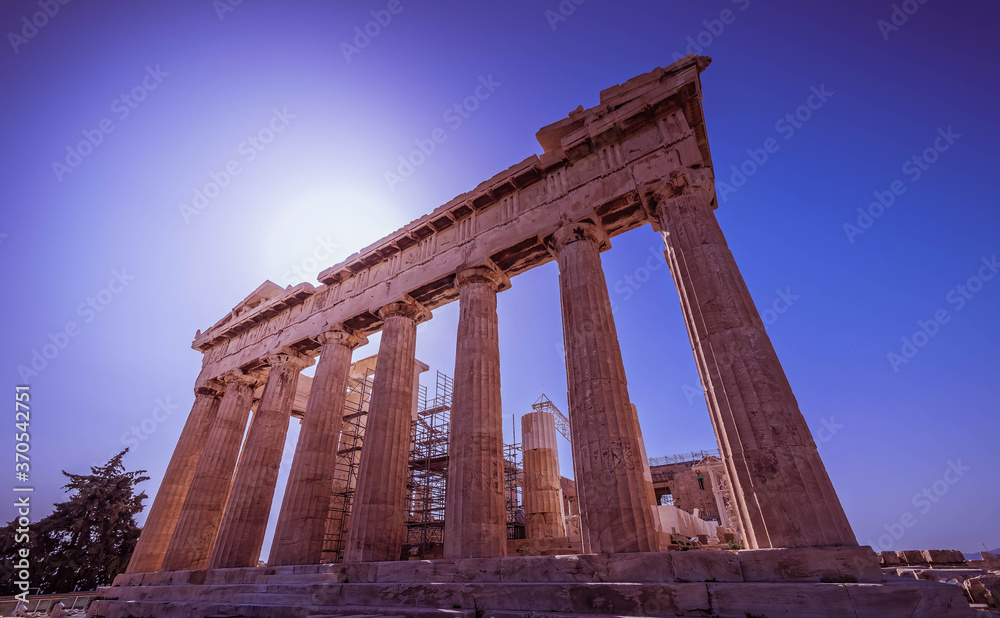 Parthenon ancient temple on acropolis of Athens under deep blue sky and direct sunlight, Greece