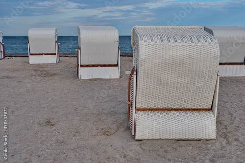 Empty beach cabins on a deserted beach. photo