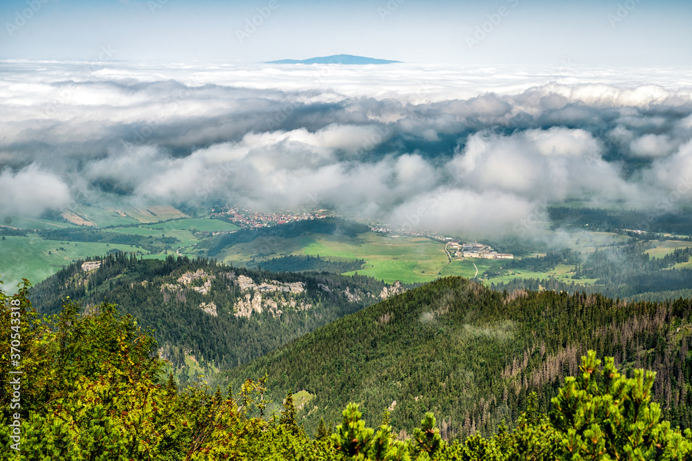 View from top of the hill Sivy vrch in Western Tatras at Slovakia through inversion. Hill Babia Hora at background
