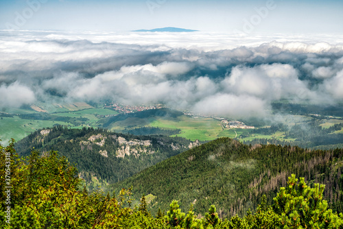 View from top of the hill Sivy vrch in Western Tatras at Slovakia through inversion. Hill Babia Hora at background photo