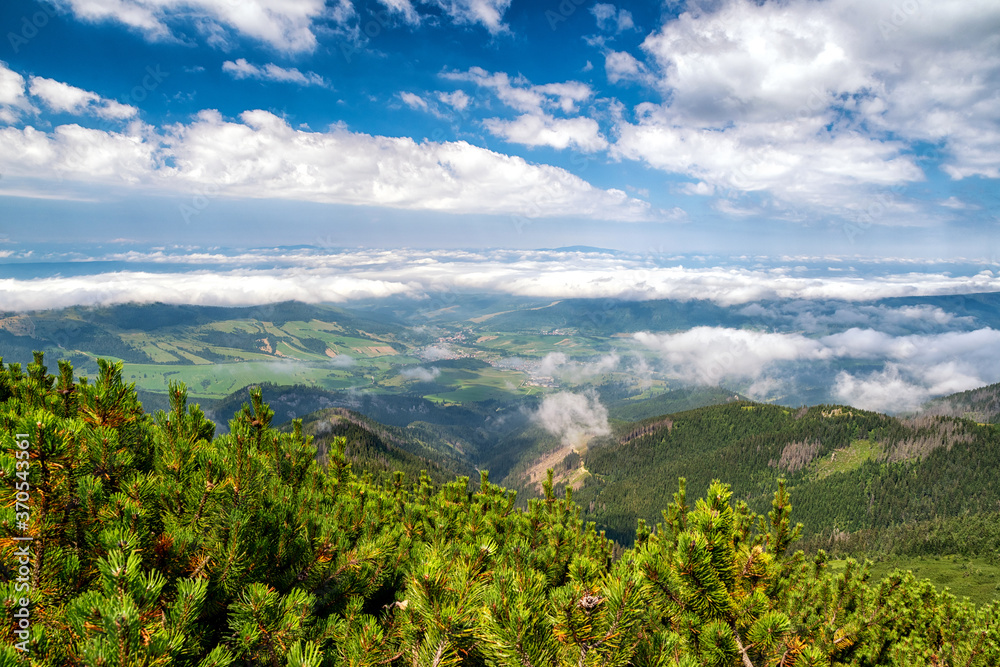 View from top of the hill Sivy vrch in Western Tatras at Slovakia through inversion. Beautiful summer mountain landscape