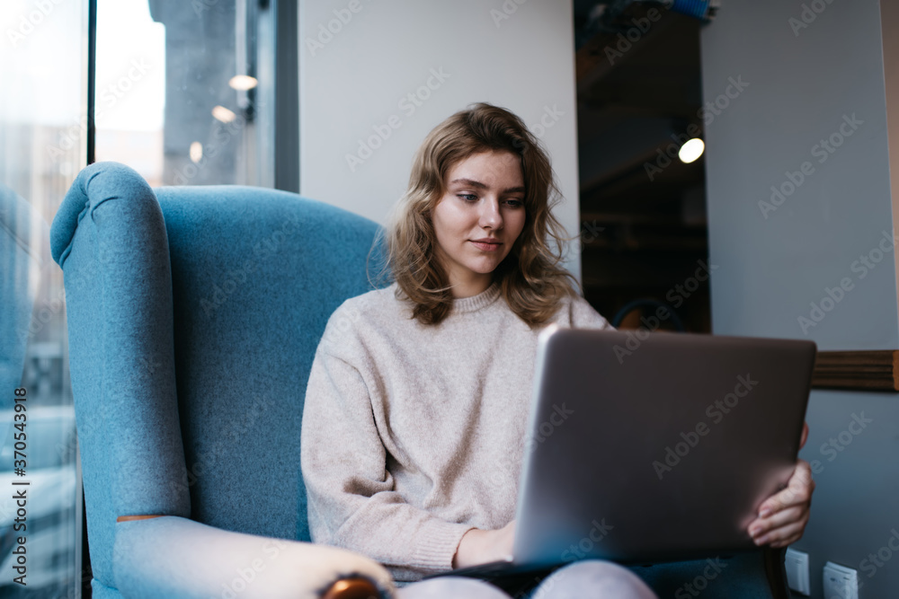 Focused young female using netbook at home Focused young female using netbook at home