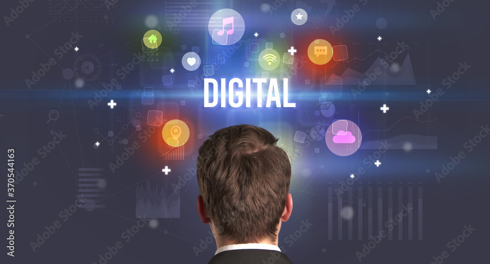 Rear view of a businessman with DIGITAL inscription, modern technology concept