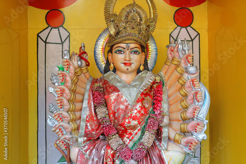 The deity of the multi-armed goddess Durga with arms in Hands.