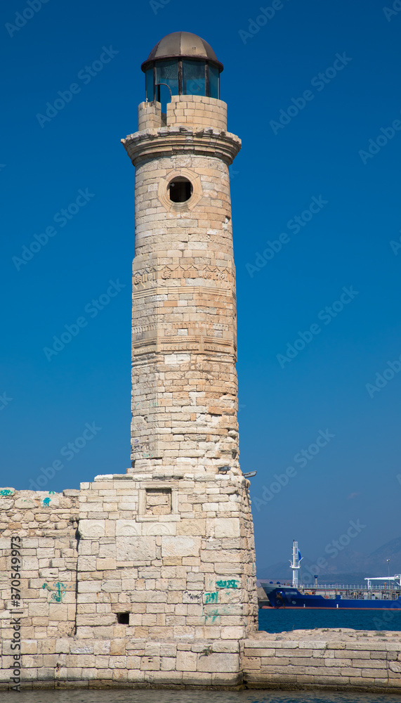 Lighthouse at the entrance to the old Venetian harbour, Rethymno, Crete, Greece Lighthouse at the entrance to the old Venetian harbour, Rethymno, Crete, Greece