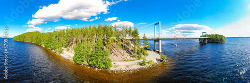 Aerial panoramic view of Karisalmi bridge on Pulkkilanharju Ridge at lake Paijanne, Paijanne National Park, Finland. Drone photography photo