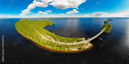 Aerial panoramic view of Karisalmi bridge on Pulkkilanharju Ridge at lake Paijanne, Paijanne National Park, Finland. Drone photography photo