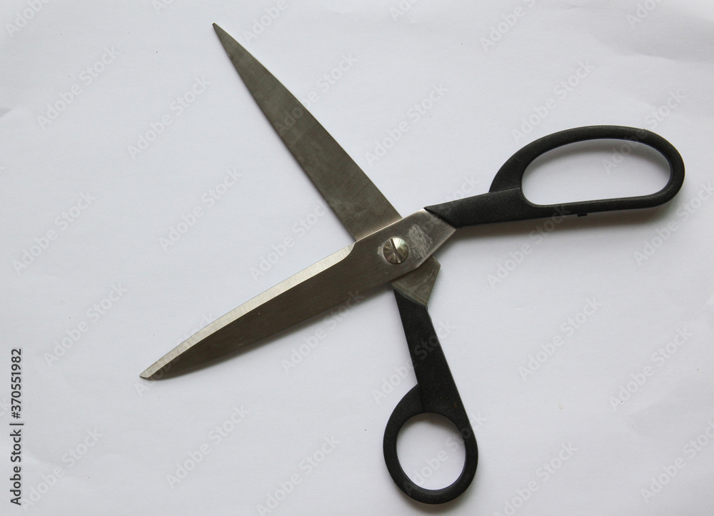 Scissors hand-operated cutting instruments. Scissors for cutting paper and thin materials, object is isolated on white background . Scissors hand-operated cutting instruments. Scissors for cutting paper and thin materials, object is isolated on white background .