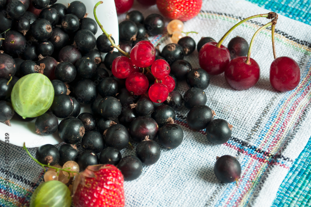 plate of mix berries poured on a napkin plate of mix berries poured on a napkin