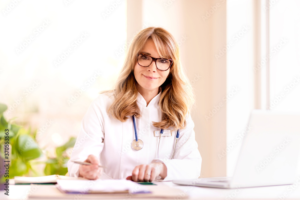 Female doctor using laptop while working Female doctor using laptop while working
