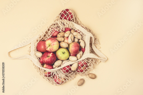 Eco Bag with Autumn Harvest Bag with Nuts and Red Apples Top View Horizontal