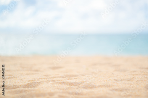 Fototapeta Naklejka Na Ścianę i Meble -  Blur tropical beach with bokeh sun light wave abstract background.