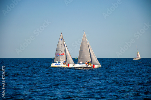 White sail on the sea. Sailing. Sailing competitions.