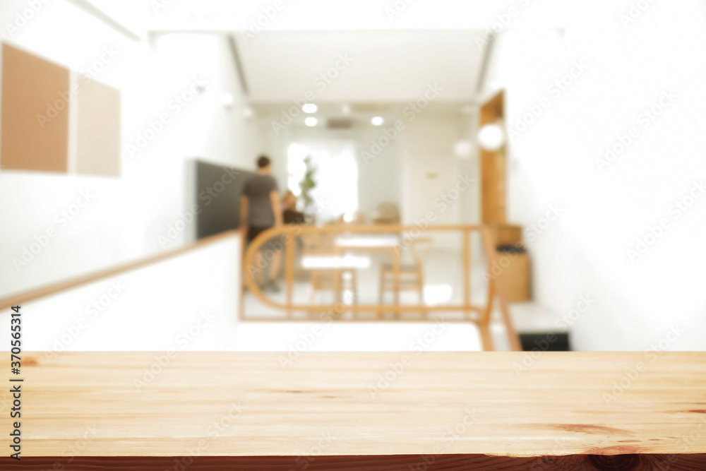 Empty wooden desk space and blurry background of home window for product display montage. Empty wooden desk space and blurry background of home window for product display montage.