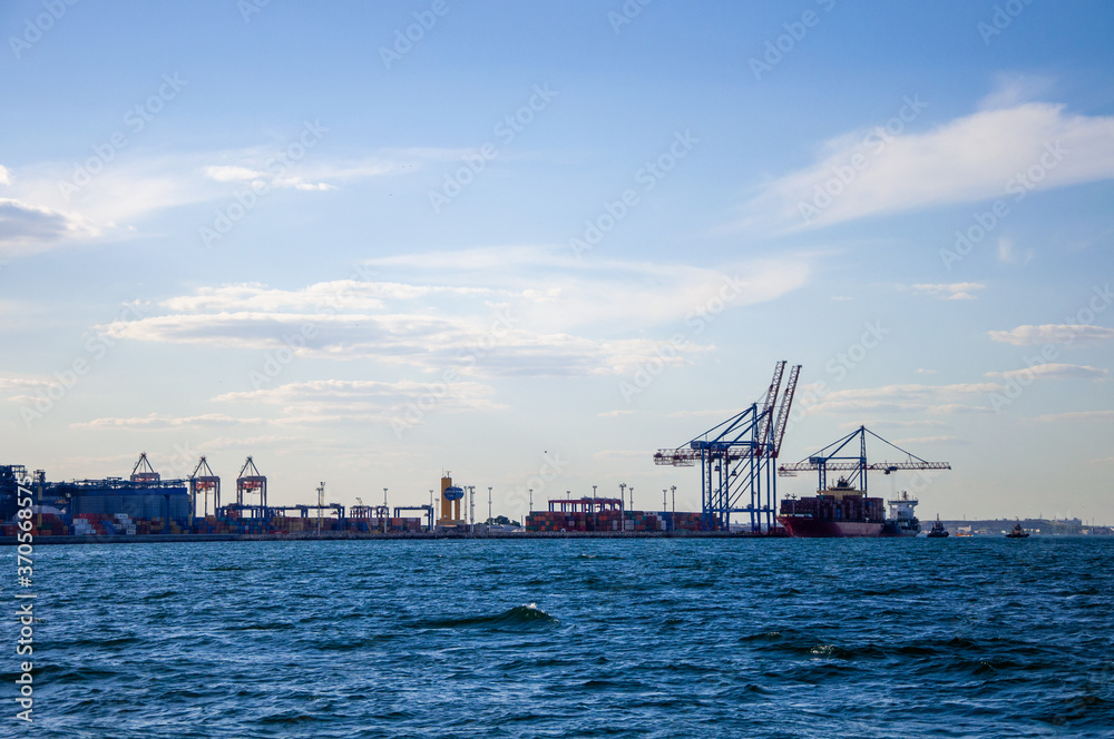 Odessa port. Loading cranes at the port. View from the sea to the port. Odessa port. Loading cranes at the port. View from the sea to the port.