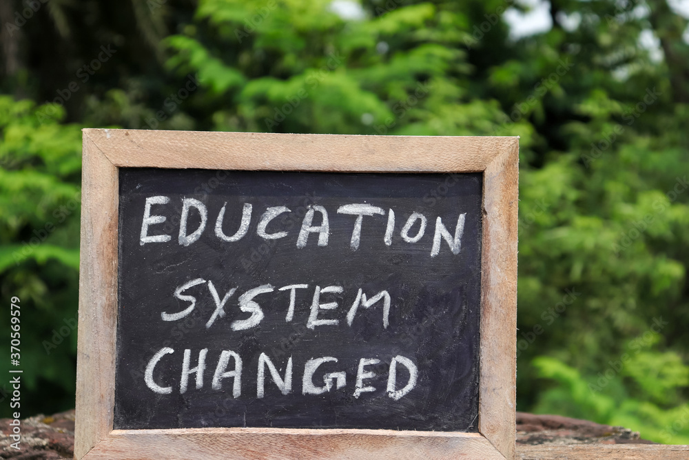 Education System Changed Written On Chalkboard with White Chalk
