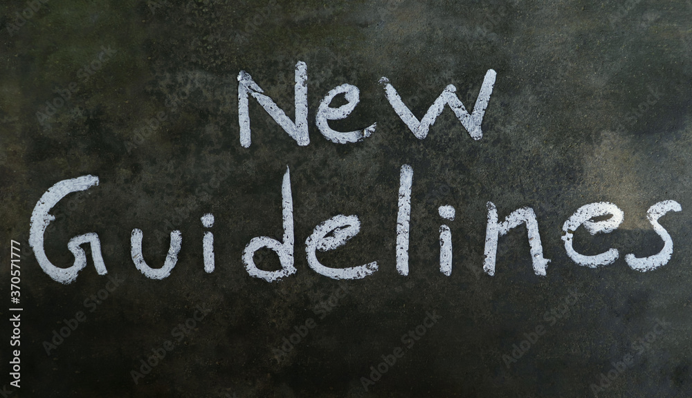 Obraz premium New Guidelines Phrase Written On Blackboard With White Chalk